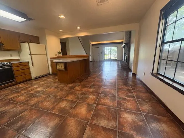 a view of a kitchen with a sink and cabinets