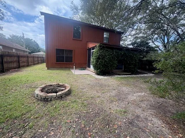 a view of a backyard of the house
