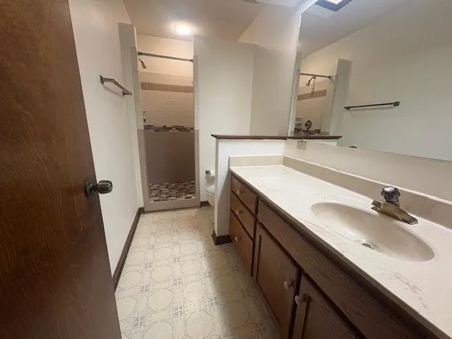a bathroom with a sink a vanity and a mirror