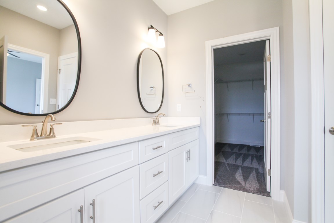 21 Fedor Circle Bloomington, IL 61705 - Photo 19 of 40 a bathroom with a sink and a mirror