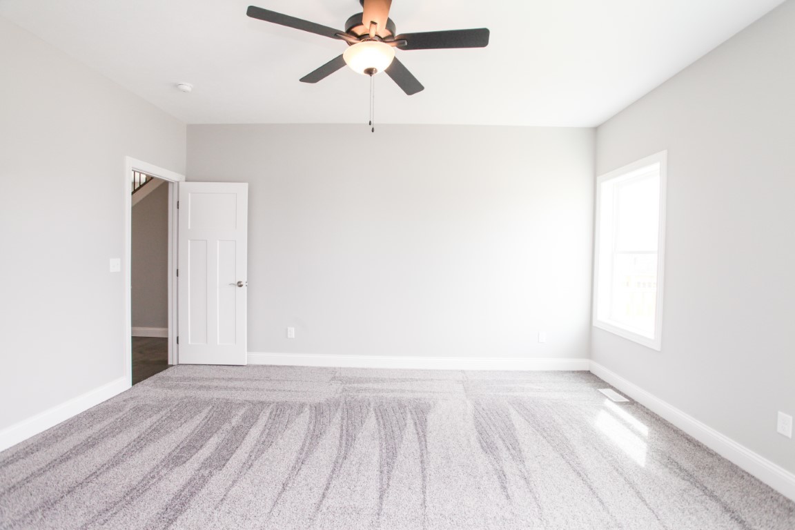 21 Fedor Circle Bloomington, IL 61705 - Photo 22 of 40 a view of an empty room with wooden floor