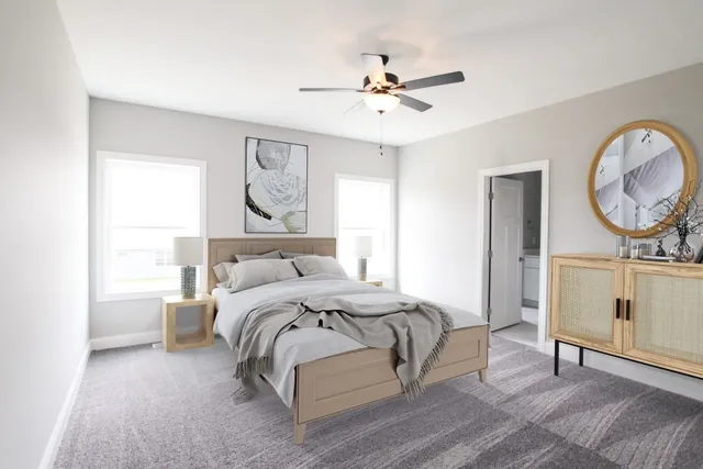 a bedroom with a bed a mirror and a window