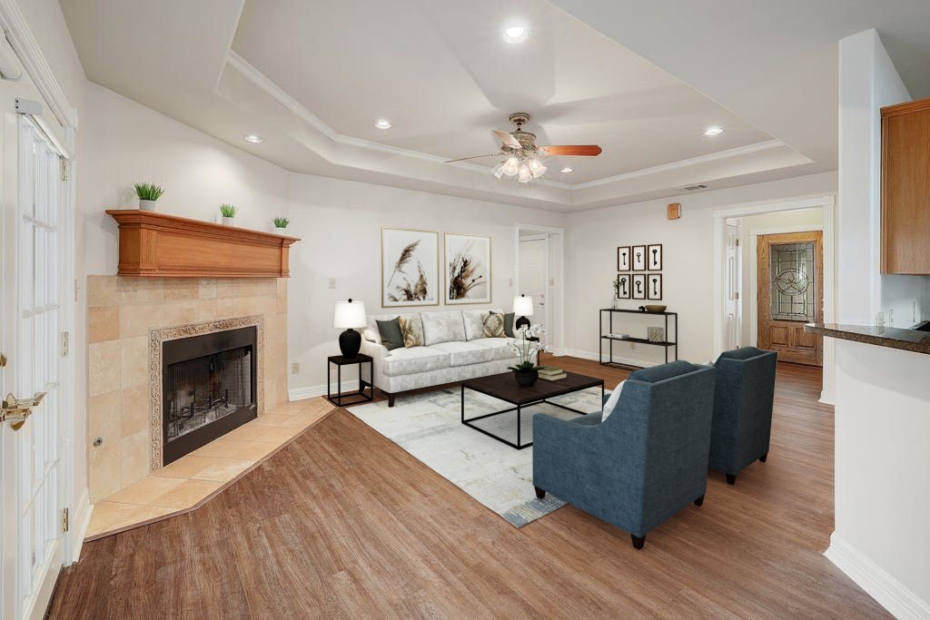 a living room with furniture and a fireplace