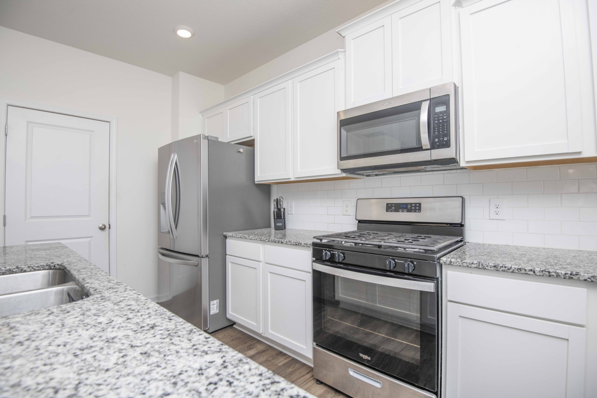 514 Cliff Street Morristown, TN 37814 - Photo 12 of 45 a kitchen with stainless steel appliances granite countertop a stove microwave and refrigerator