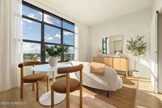 a dining room with furniture and wooden floor