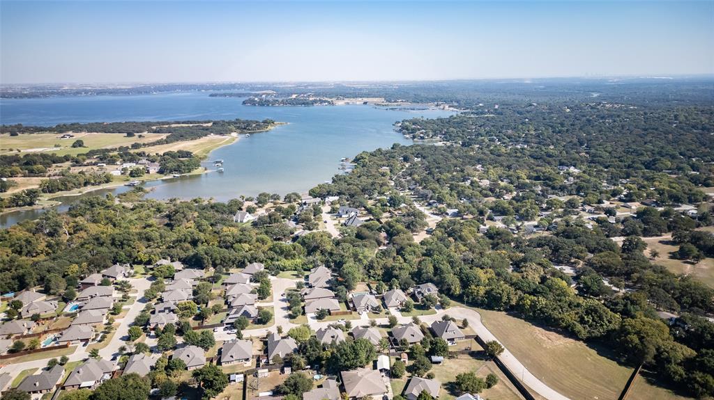 409 Corriente Trail Azle, TX 76020 - Photo 2 of 36 an aerial view of a house with a lake view