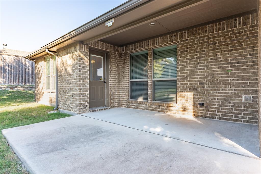 409 Corriente Trail Azle, TX 76020 - Photo 23 of 36 a view of a house with a yard and garage