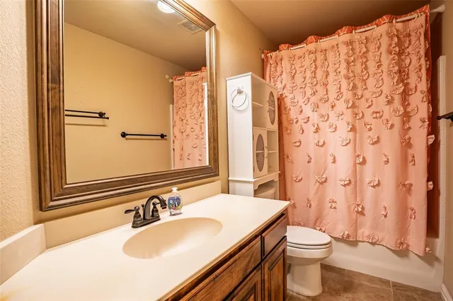 a view of a house with a yard and garage