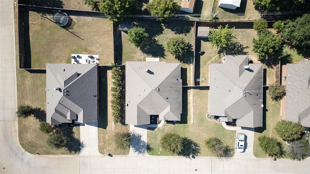 409 Corriente Trail Azle, TX 76020 - Photo 26 of 36 an aerial view of a house with a yard