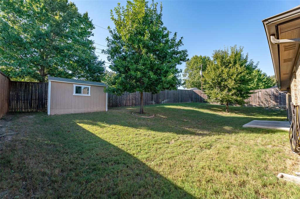 409 Corriente Trail Azle, TX 76020 - Photo 33 of 36 Storage shed for the mowers or extras