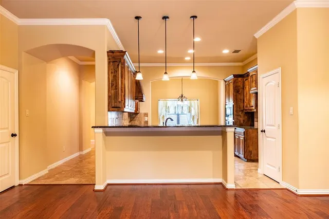 a view of a kitchen with a large window