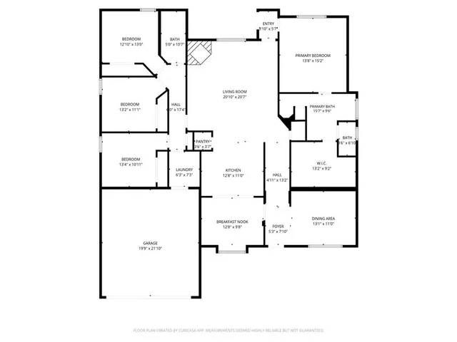 a view of an empty room with wooden floor fireplace and a window