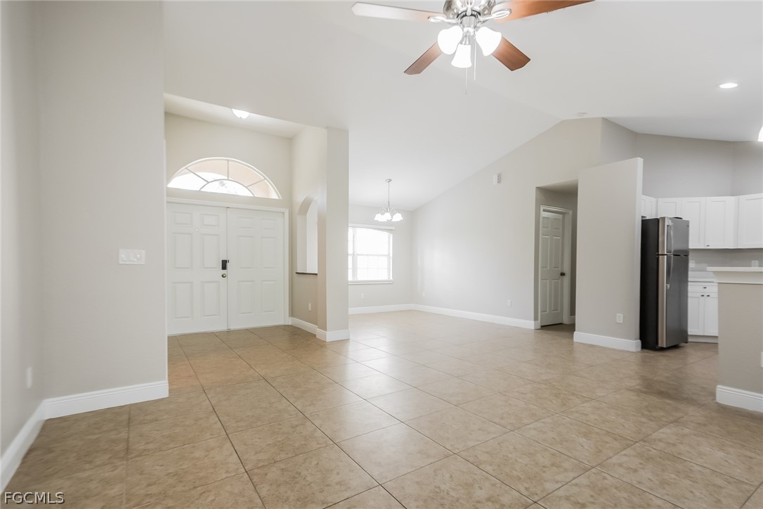 1018 Card Street East Lehigh Acres, FL 33974 - Photo 3 of 16 a view of an empty room with window and chandelier fan