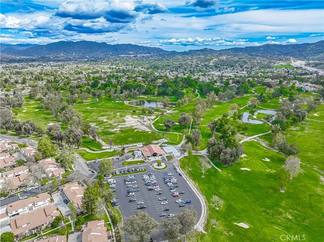 a view of a patio with table and chairs and potted plants