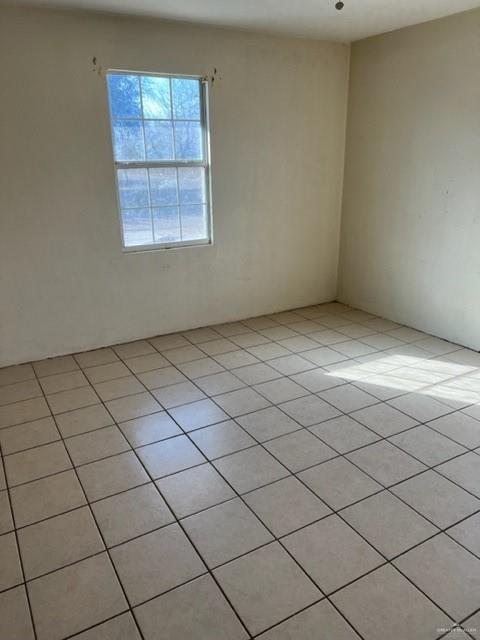 294 Venus Street Rio Grande City, TX 78582 - Photo 6 of 7 Spare room featuring light tile patterned floors