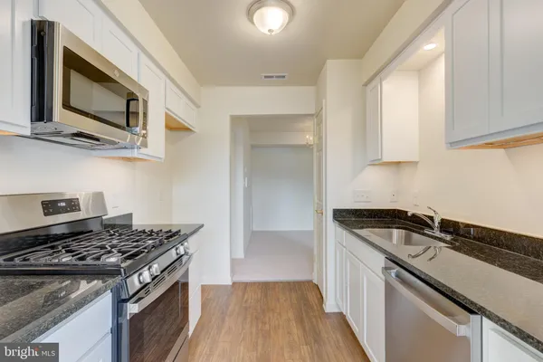 a kitchen with a stove and a microwave