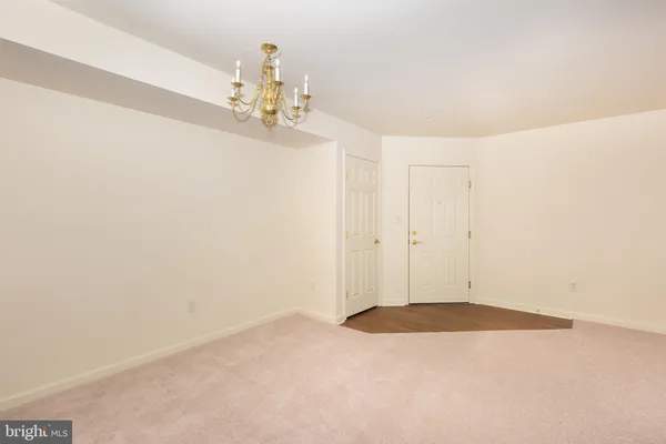 a view of a chandelier fan in a room