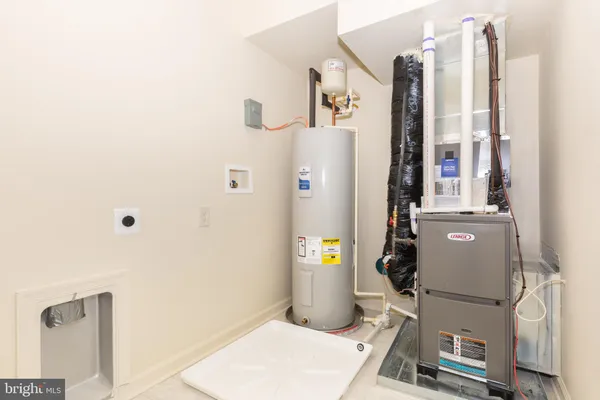 a room with refrigerator and tub