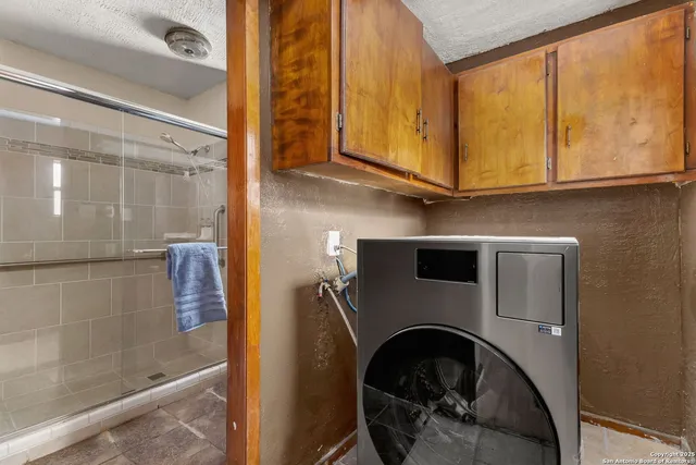 a bedroom with a bed and a cabinets