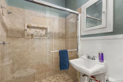 a kitchen with a table chairs and a sink