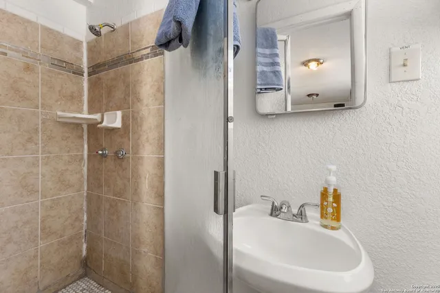 a bathroom with a sink and a mirror