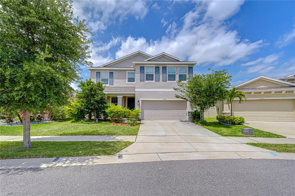 16607 Goose Ribbon Place Wimauma, FL 33598 - Photo 33 of 35 a front view of a house with a yard
