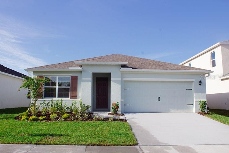 1274 Red Hill Road Davenport, FL 33837 - Photo 1 of 1 a front view of house with a yard