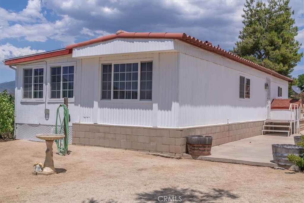53215 Yucca Road Anza, CA 92539 - Photo 1 of 1 a front view of a house with a yard