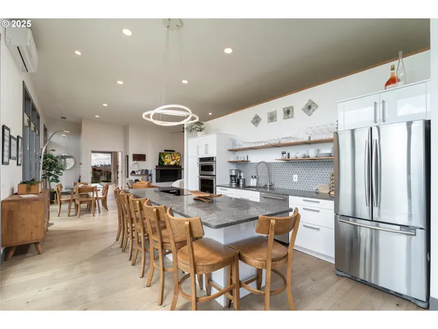 a kitchen with counter top space and living room