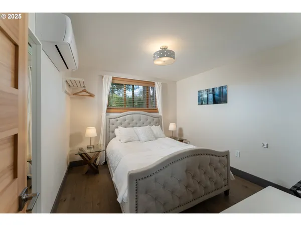a bathroom with a sink mirror and toilet
