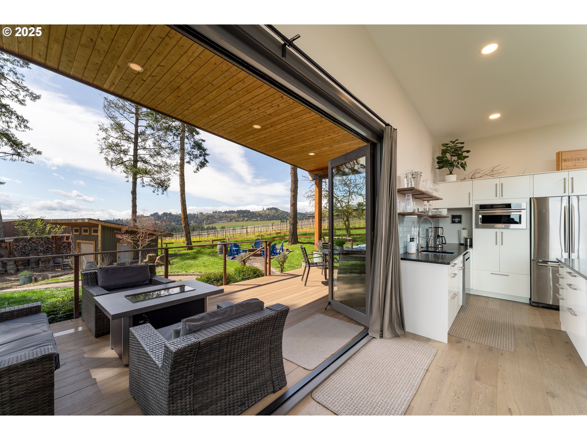 8331 Northeast Worden Hill Road Dundee, OR 97115 - Photo 21 of 48 a living room with furniture and a floor to ceiling window