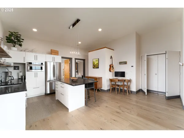 a bedroom with a bed and a large mirror