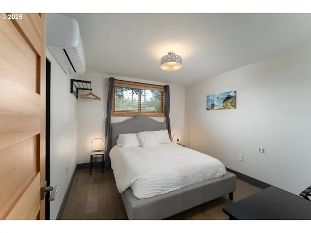 a bathroom with a sink a toilet a large mirror and shower