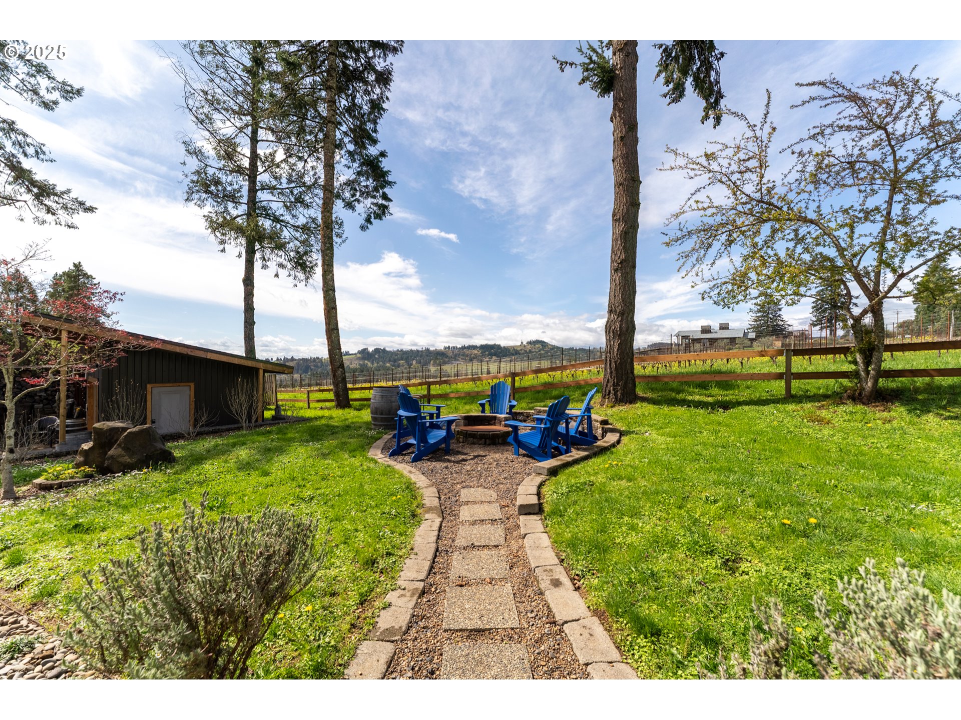 8331 Northeast Worden Hill Road Dundee, OR 97115 - Photo 33 of 48 a view of a backyard with couches plants and large trees