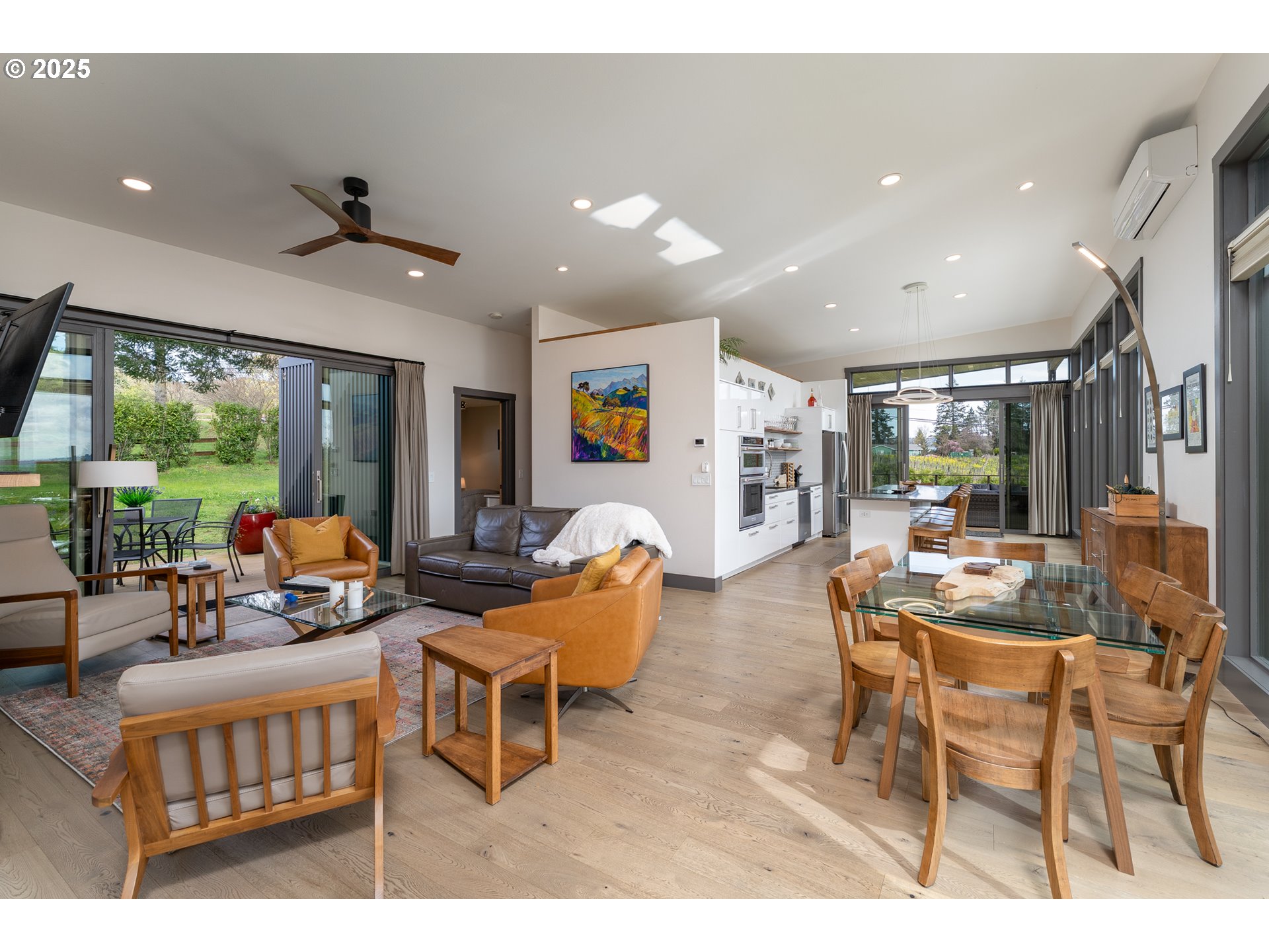 8331 Northeast Worden Hill Road Dundee, OR 97115 - Photo 4 of 48 a living room with furniture a large window and a chandelier