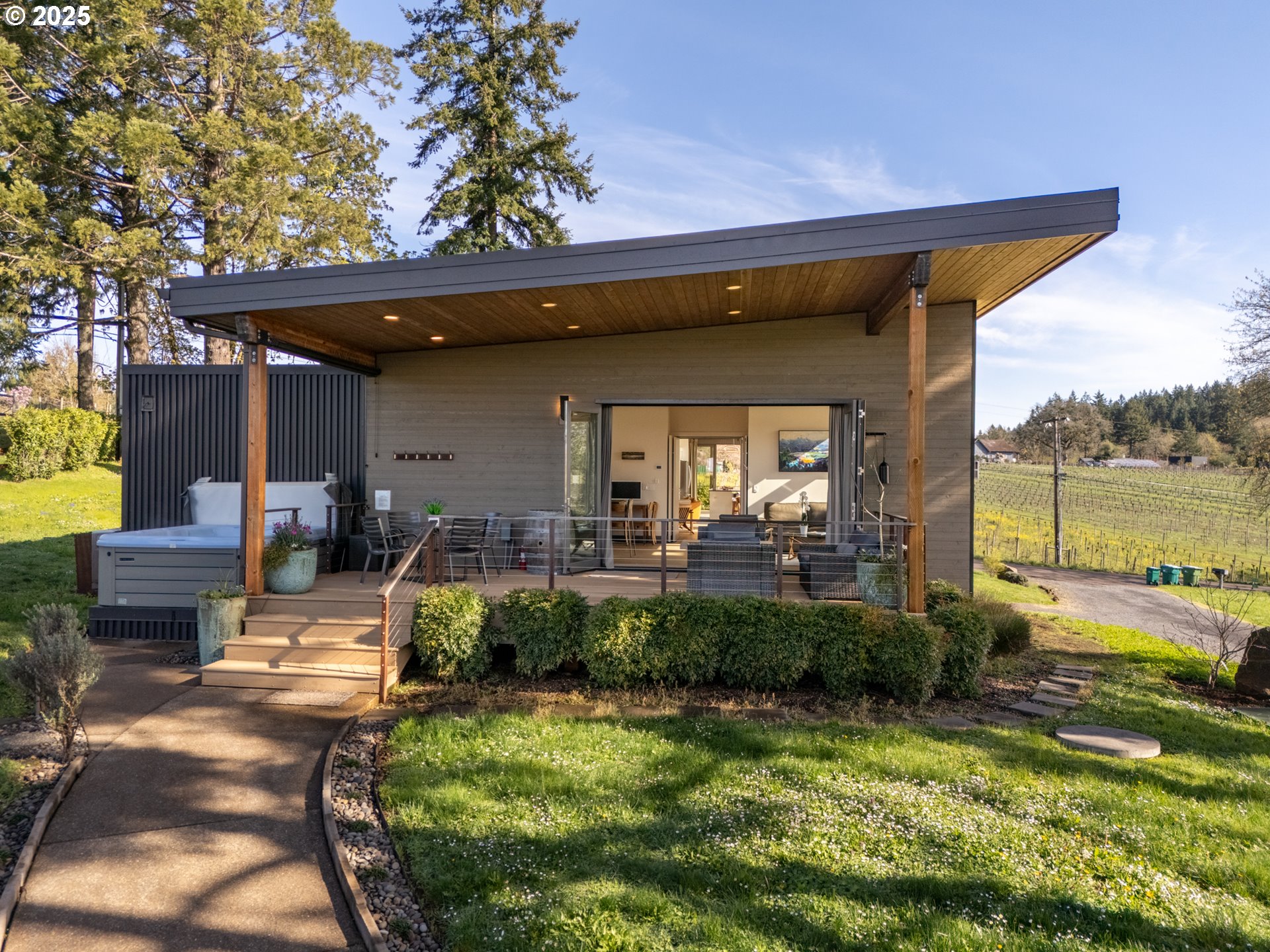 8331 Northeast Worden Hill Road Dundee, OR 97115 - Photo 42 of 48 a view of a patio with table and chairs potted plants and large tree