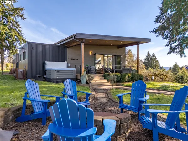 a view of a chairs and table in the patio