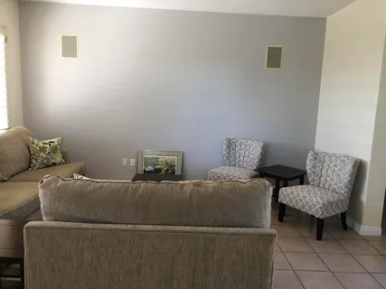 a living room with furniture and a couch