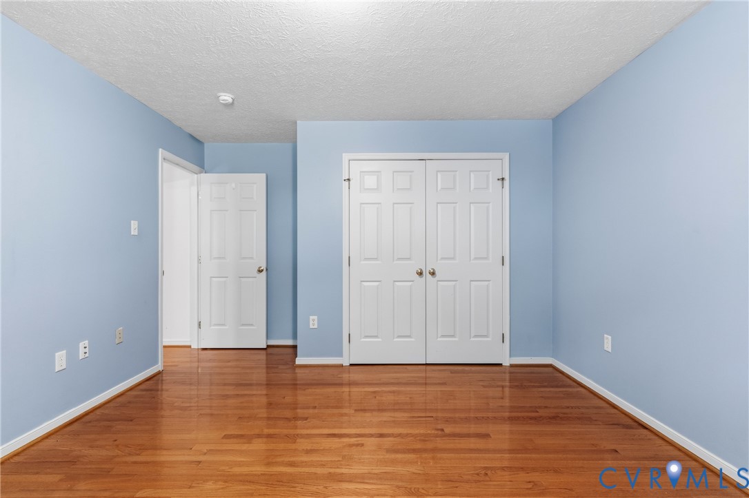 12654 Mt Olive Cohoke Road West Point, VA 23181 - Photo 24 of 31 a view of an empty room with wooden floor