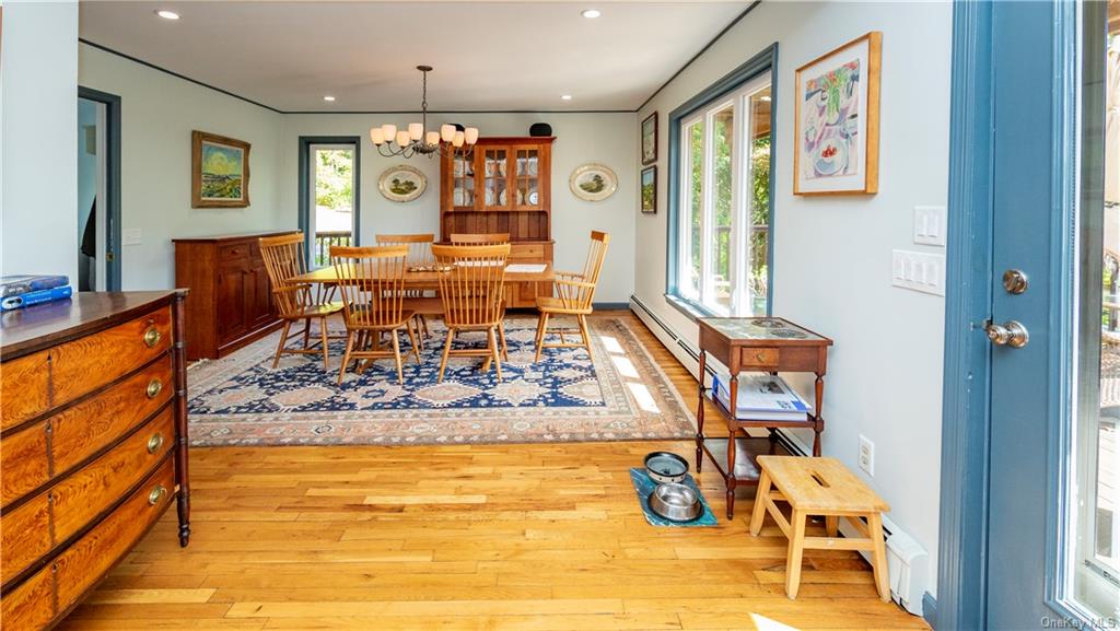 206 Quaker Hill Road Pawling, NY 12564 - Photo 21 of 36 Dining room featuring an inviting chandelier, light hardwood / wood-style floors, and a wealth of natural light