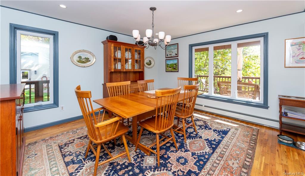 206 Quaker Hill Road Pawling, NY 12564 - Photo 23 of 36 Dining room with a chandelier, light hardwood / wood-style floors, and baseboard heating