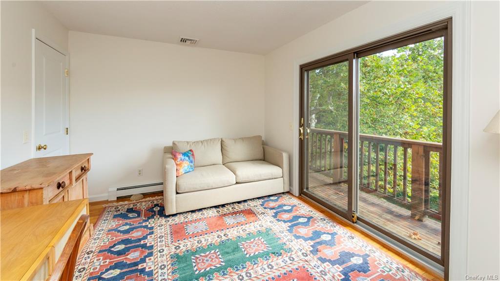 206 Quaker Hill Road Pawling, NY 12564 - Photo 25 of 36 Living room with light hardwood / wood-style floors and baseboard heating