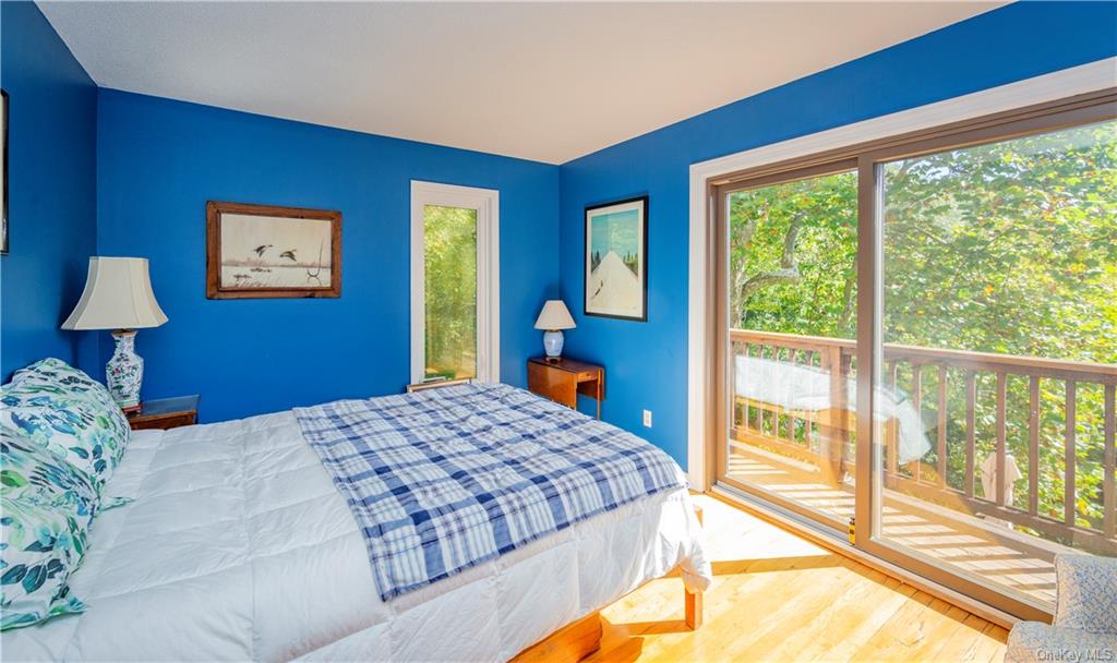 206 Quaker Hill Road Pawling, NY 12564 - Photo 26 of 36 Bedroom featuring wood-type flooring and access to outside
