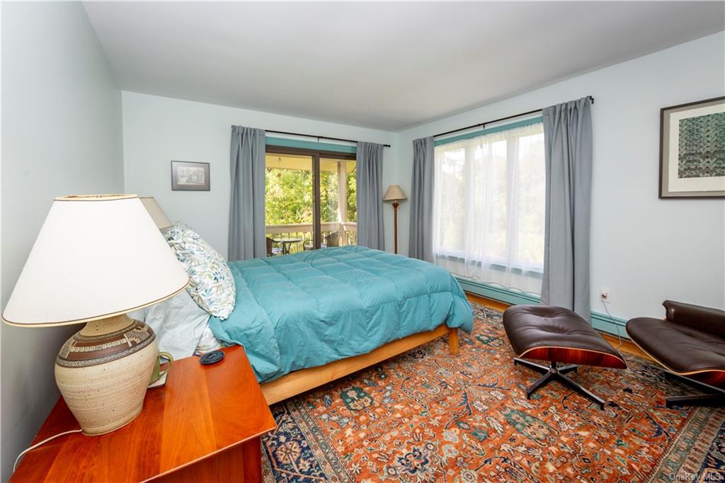 206 Quaker Hill Road Pawling, NY 12564 - Photo 29 of 36 Bedroom with a baseboard heating unit and access to outside