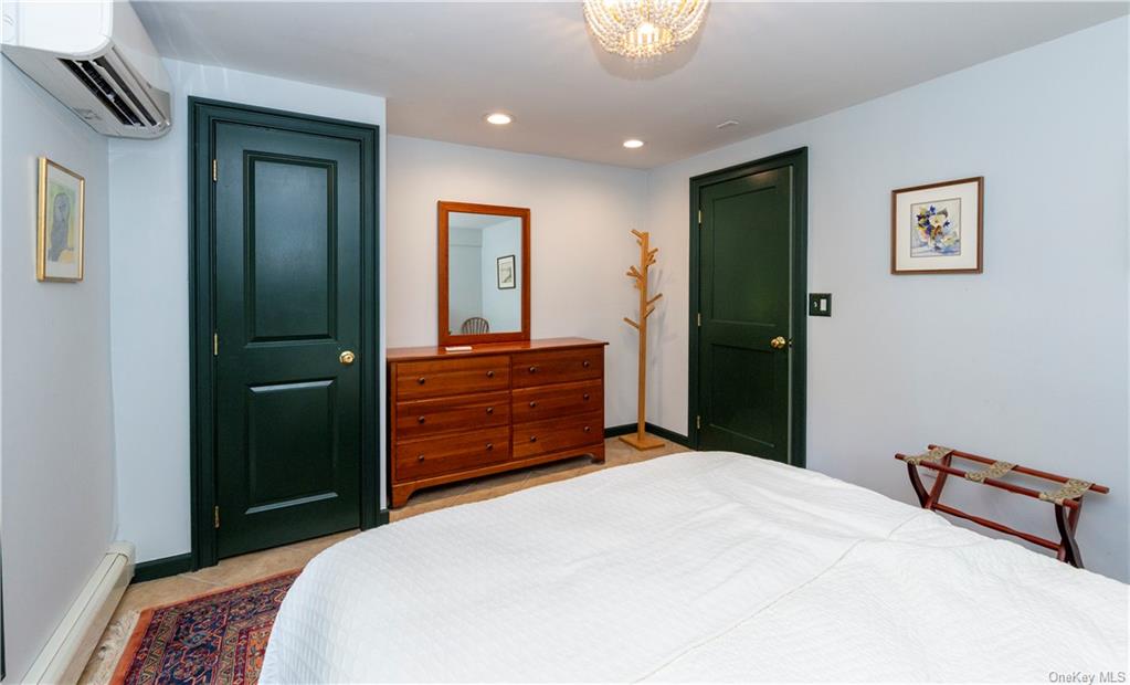 206 Quaker Hill Road Pawling, NY 12564 - Photo 35 of 36 Tiled bedroom with a baseboard heating unit and a wall mounted AC