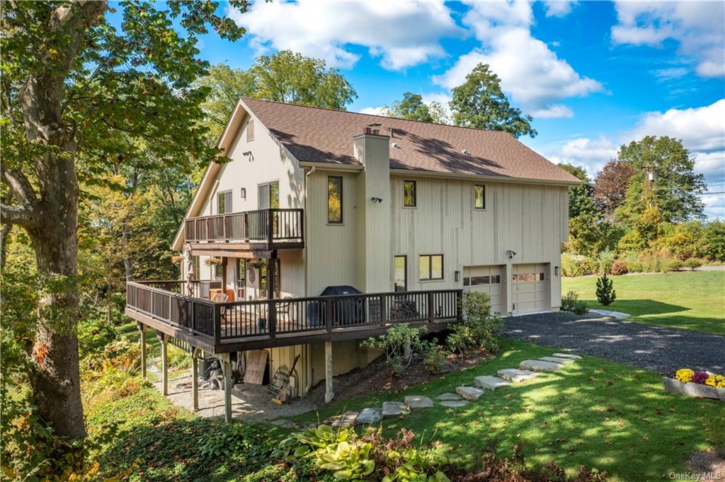 206 Quaker Hill Road Pawling, NY 12564 - Photo 5 of 36 Back of property featuring a yard, a garage, and a wooden deck