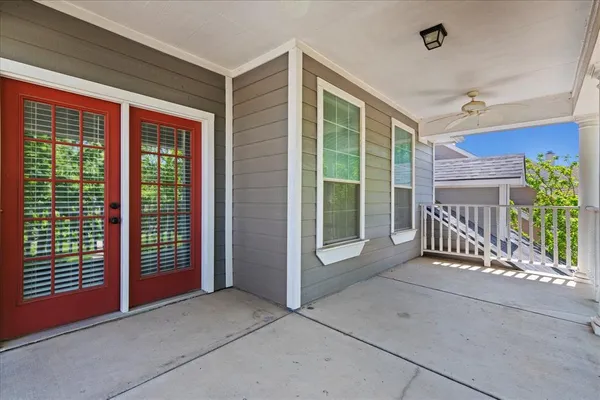a view of backyard with deck and outdoor seating