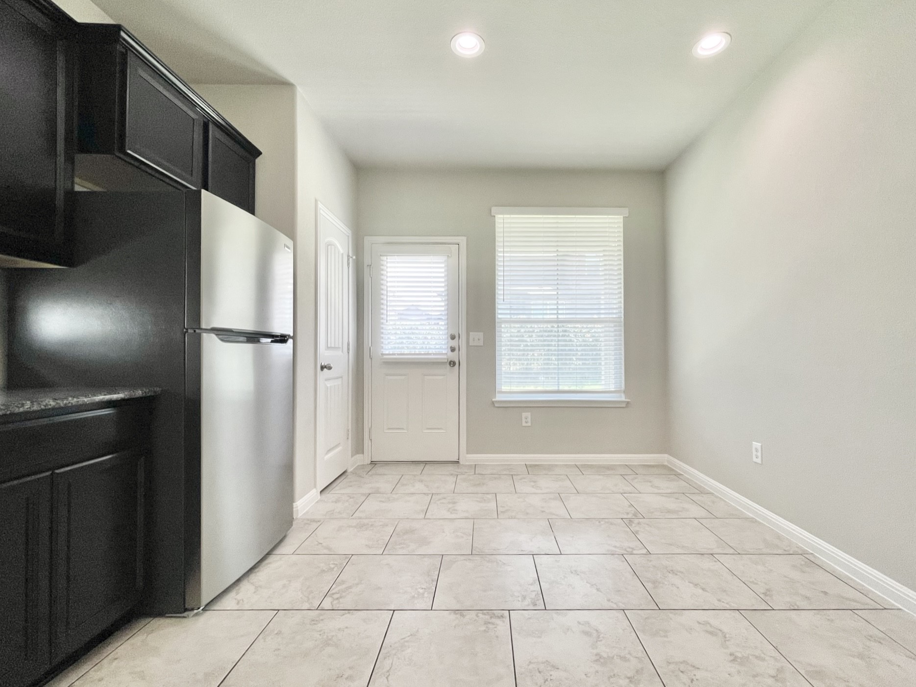 407 Rhetoric Way Pflugerville, TX 78660 - Photo 14 of 38 a view of an empty room and a window