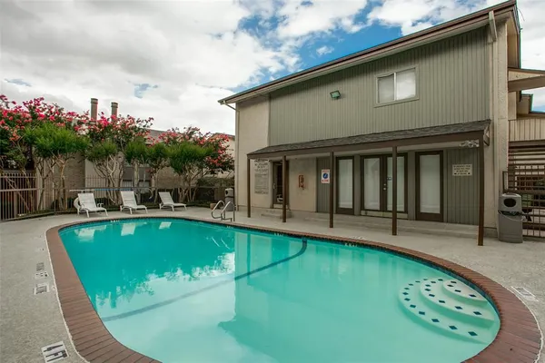 a view of a house with swimming pool
