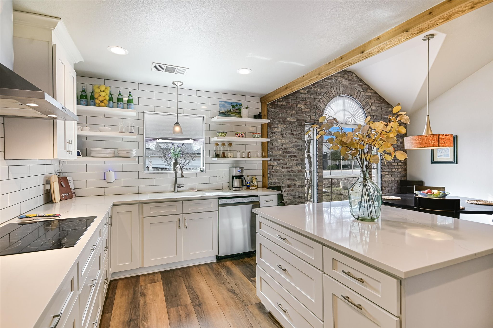 a kitchen with counter top space sink and stove